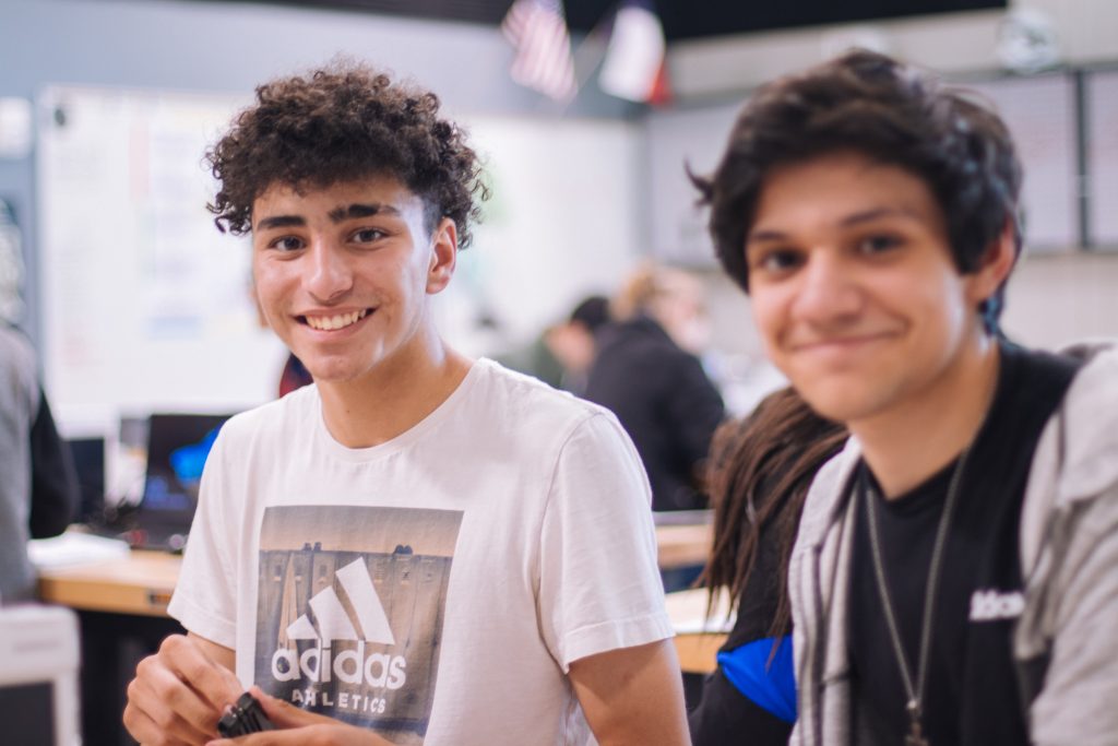 Two young adult boys looking happy, connected and confident; confidence classes for young adults, teen confidence workshops