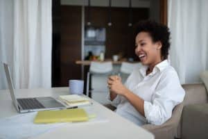 African american woman appearing confident and happy due to transformational leadership trainings and executive presence courses