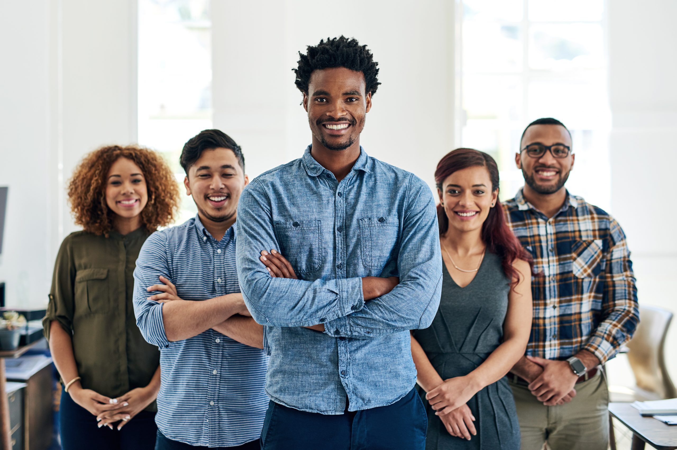 Five confident young leaders in a group, depicting possible effects of confidence tools that can be found in youth leadership programs