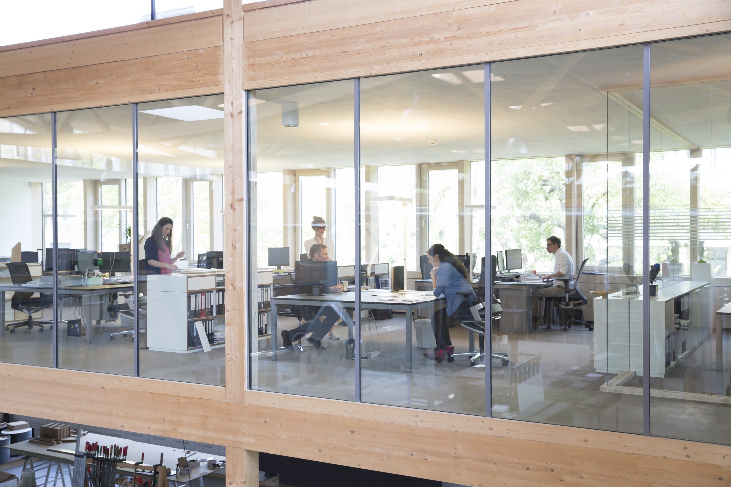 Office with clear windows with participants from Transformational Management Training Santa Clara and Leadership Training Santa Clara.